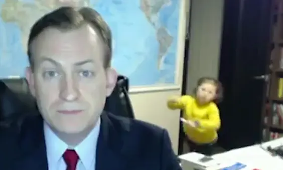 A toddler walks into a BBC newscaster's live broadcast